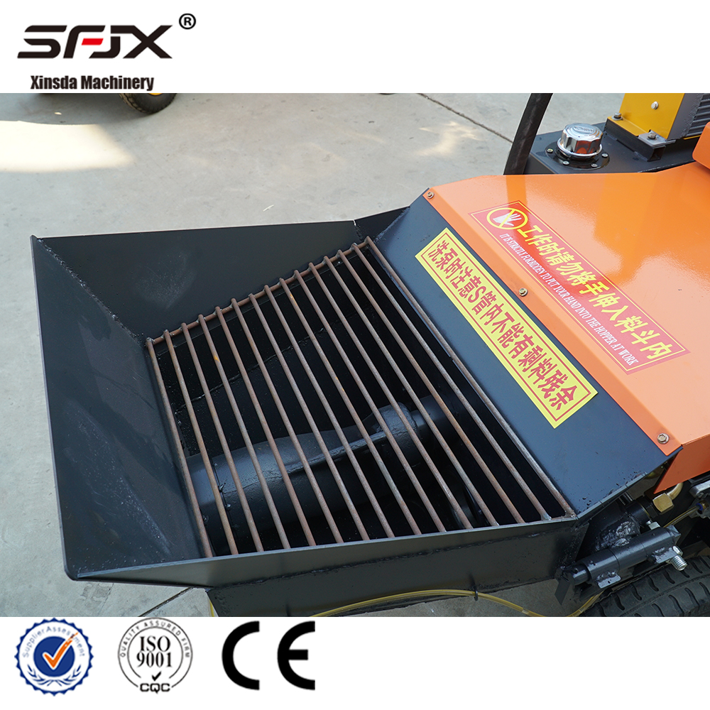 Concrete pump hopper with protective grate and safety labels