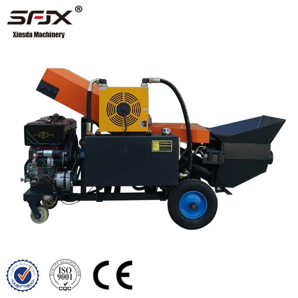Side view of the orange and black engine-powered concrete pump with hopper and cooling assembly