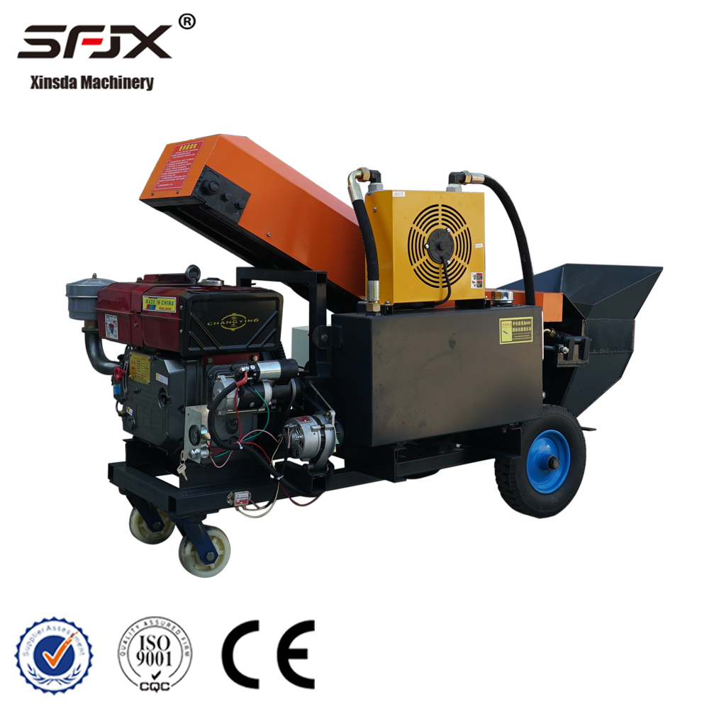 Rear angle of the concrete pump showing its diesel engine and wheeled frame